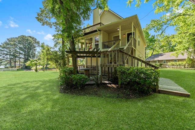 exterior space with a lawn and a pergola