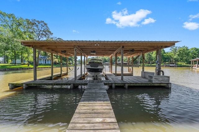 view of dock with boat lift and a water view