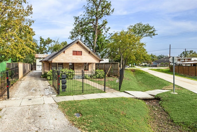 bungalow-style house featuring a front yard