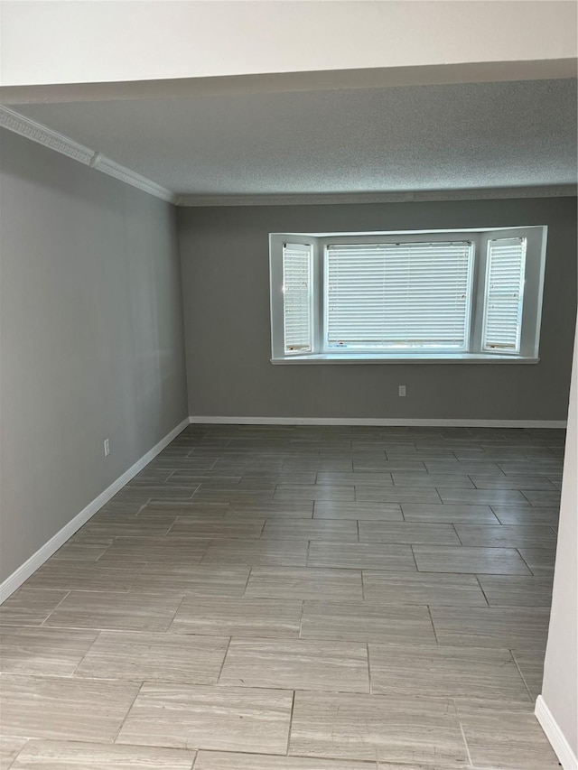 spare room featuring ornamental molding