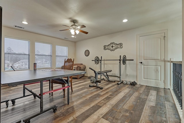 interior space featuring hardwood / wood-style flooring and ceiling fan