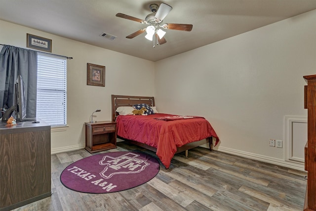 bedroom featuring ceiling fan and wood-type flooring