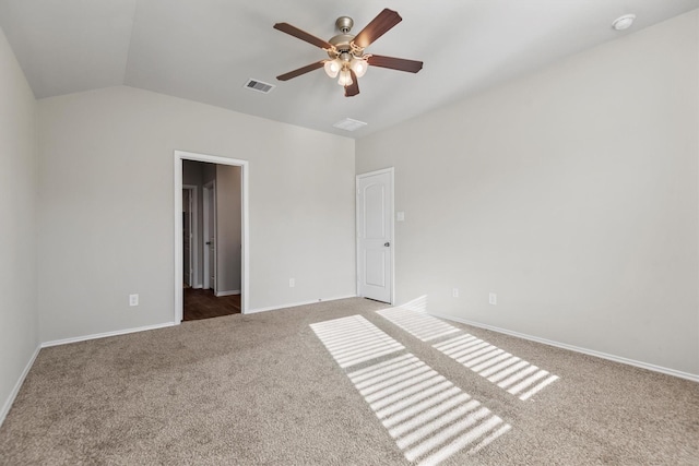 unfurnished bedroom with ceiling fan, carpet floors, and vaulted ceiling