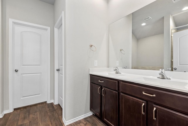 bathroom featuring hardwood / wood-style floors and vanity