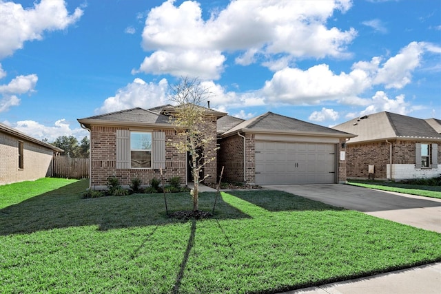 view of front of property featuring a garage and a front lawn