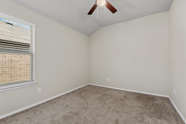 unfurnished room featuring carpet flooring, ceiling fan, a healthy amount of sunlight, and lofted ceiling