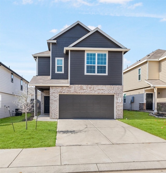 view of front of home with a garage and a front yard