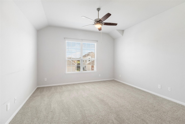 unfurnished room featuring ceiling fan, carpet floors, and lofted ceiling