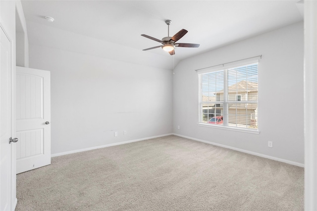 unfurnished room featuring light carpet, ceiling fan, and lofted ceiling