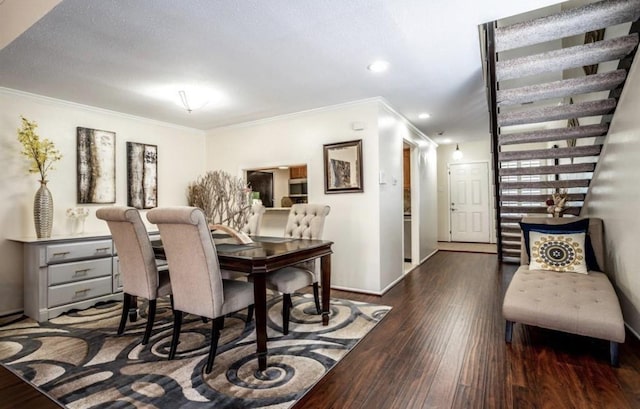 dining space with dark hardwood / wood-style floors and ornamental molding