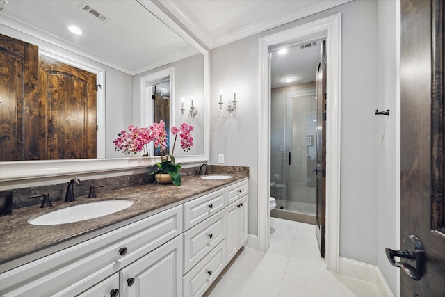 bathroom with tile patterned floors, walk in shower, ornamental molding, vanity, and toilet