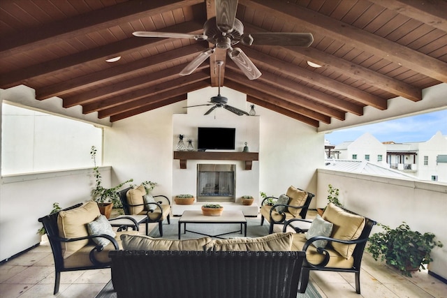 view of patio with an outdoor living space with a fireplace and ceiling fan