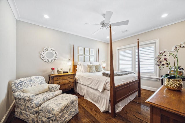 bedroom with ceiling fan, ornamental molding, and dark wood-type flooring