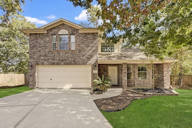 view of front of house featuring a garage and a front yard