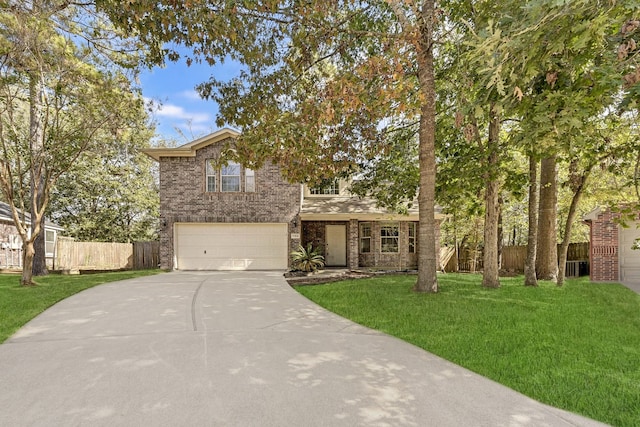 view of front of property featuring a front lawn and a garage