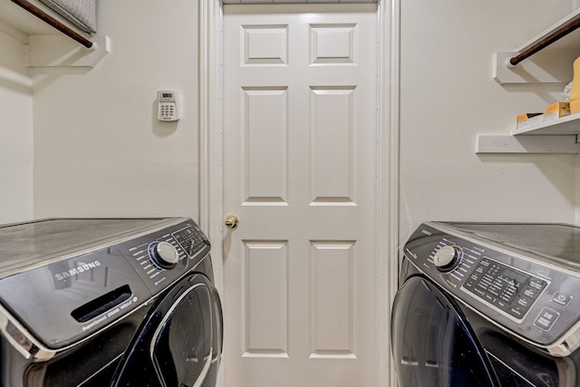 clothes washing area featuring independent washer and dryer