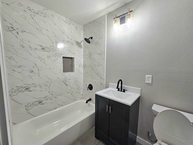 full bathroom featuring vanity, tiled shower / bath combo, toilet, and tile patterned flooring