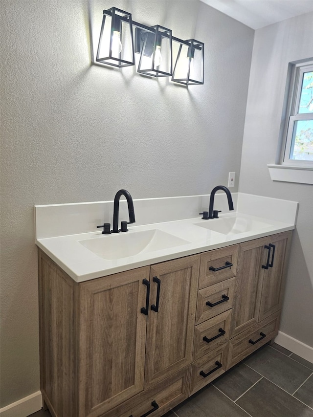 bathroom featuring tile patterned floors and vanity