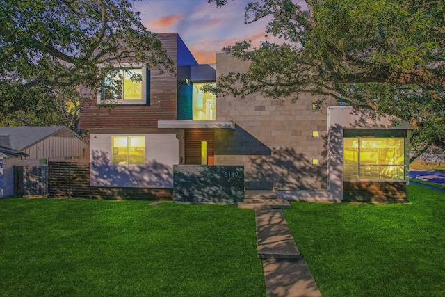 view of front of property with a yard