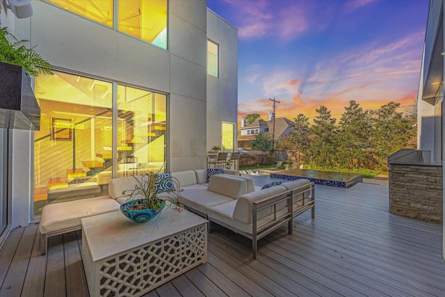 wooden terrace featuring an outdoor living space