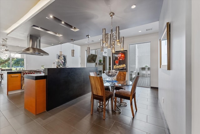 dining room with recessed lighting, visible vents, dark tile patterned floors, and an inviting chandelier