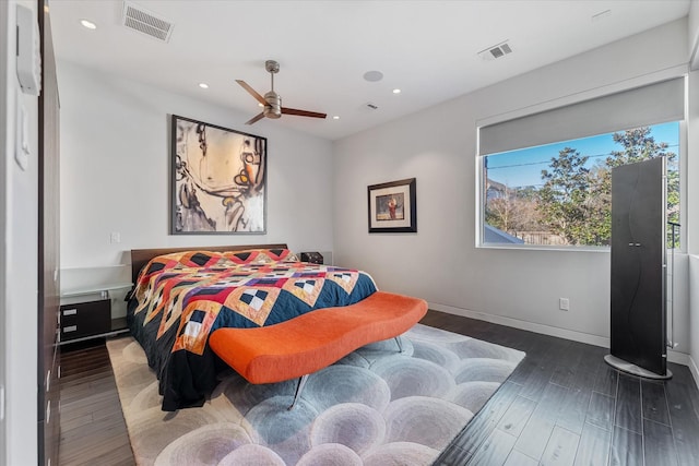 bedroom featuring baseboards, visible vents, dark wood-type flooring, and recessed lighting