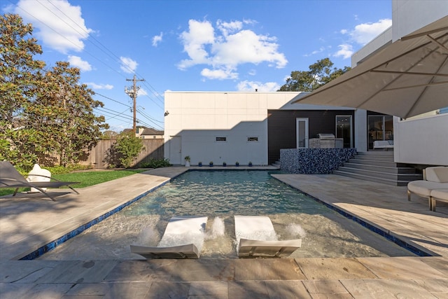 view of pool with a patio area, fence, and a fenced in pool