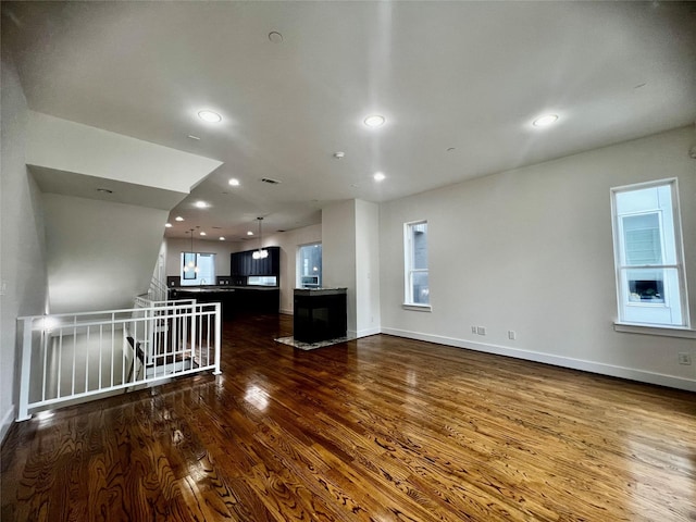 empty room featuring dark hardwood / wood-style flooring