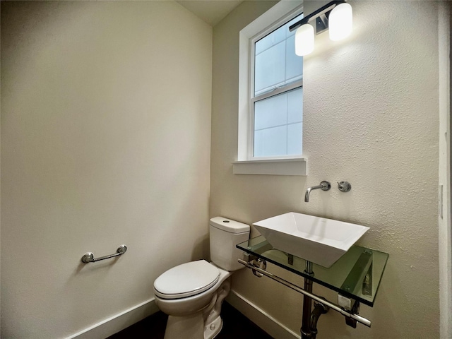 bathroom with sink and toilet