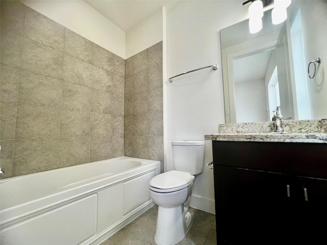 full bathroom featuring tile patterned flooring, vanity, tiled shower / bath combo, and toilet