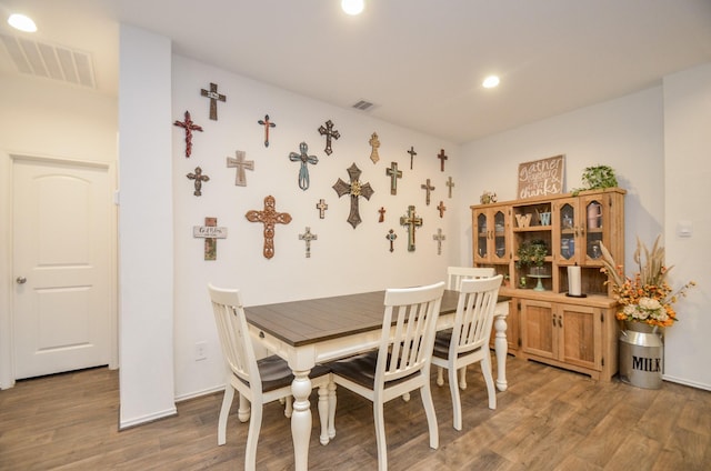 dining room with wood-type flooring