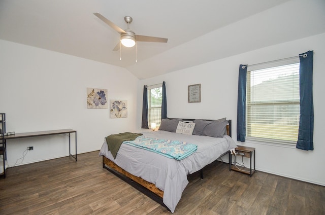 bedroom featuring ceiling fan, dark hardwood / wood-style floors, and lofted ceiling