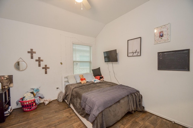 bedroom with ceiling fan, dark hardwood / wood-style floors, and lofted ceiling