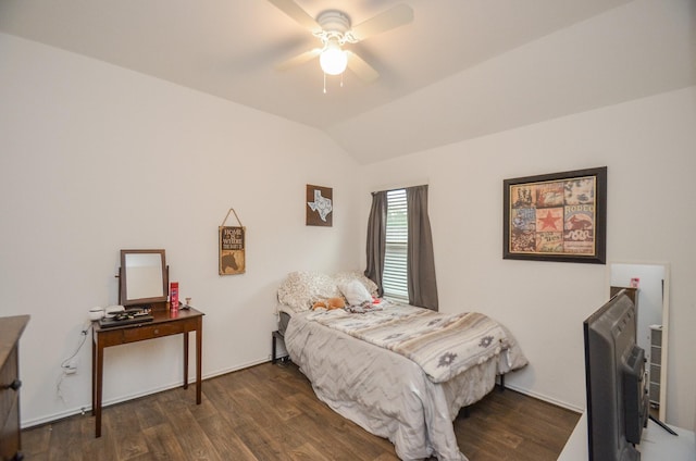 bedroom featuring ceiling fan, dark hardwood / wood-style floors, and vaulted ceiling