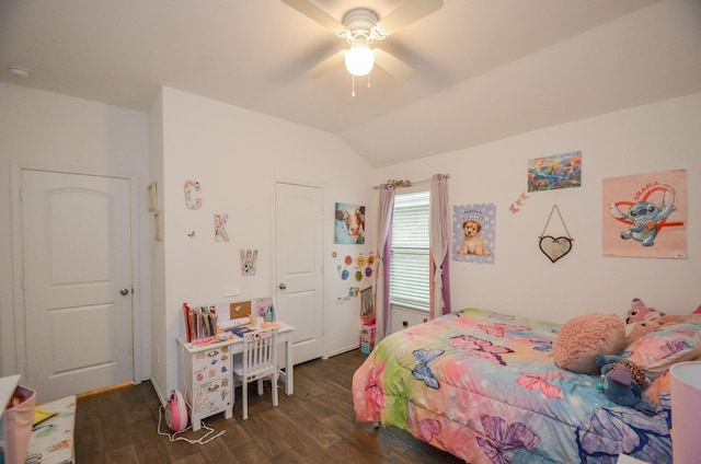 bedroom with ceiling fan, dark hardwood / wood-style floors, and vaulted ceiling