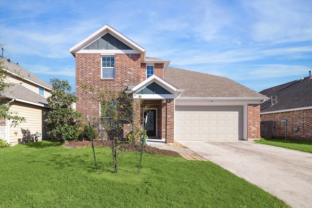 view of front of property with a garage and a front lawn