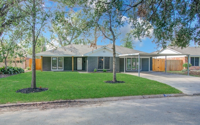 ranch-style house with a front yard and a carport