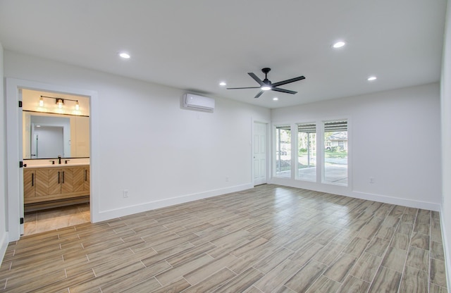 empty room featuring ceiling fan and an AC wall unit