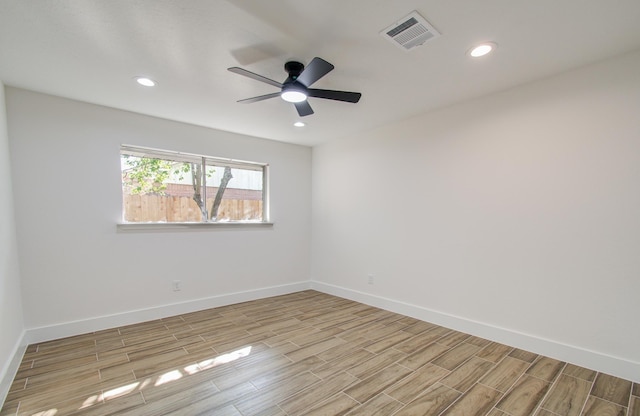 unfurnished room with ceiling fan