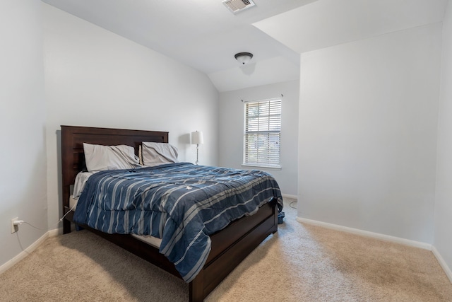 bedroom featuring light carpet and lofted ceiling