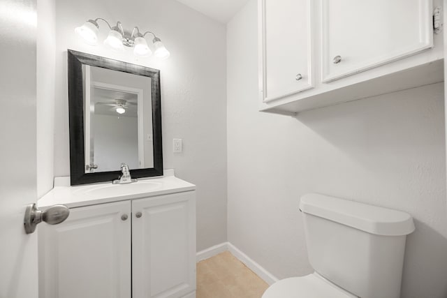 bathroom featuring ceiling fan, tile patterned flooring, vanity, and toilet