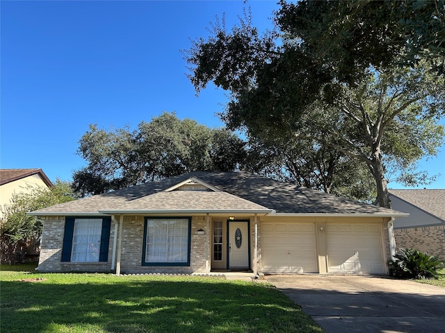 single story home featuring a front yard and a garage