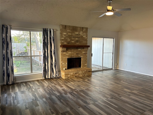 unfurnished living room featuring a textured ceiling, a brick fireplace, ceiling fan, and lofted ceiling