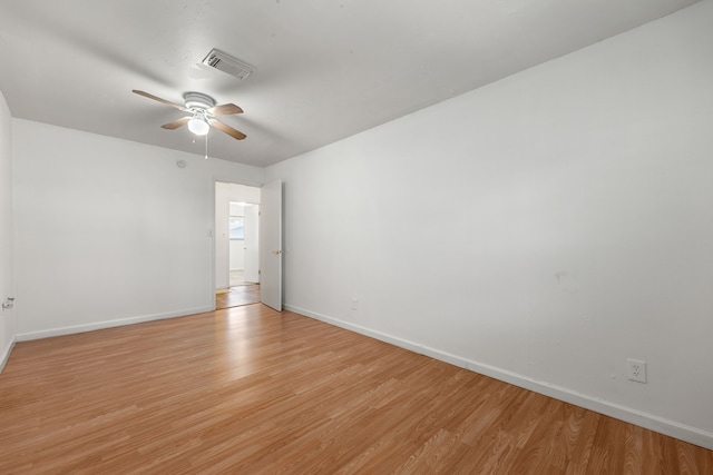 unfurnished room with ceiling fan and light wood-type flooring