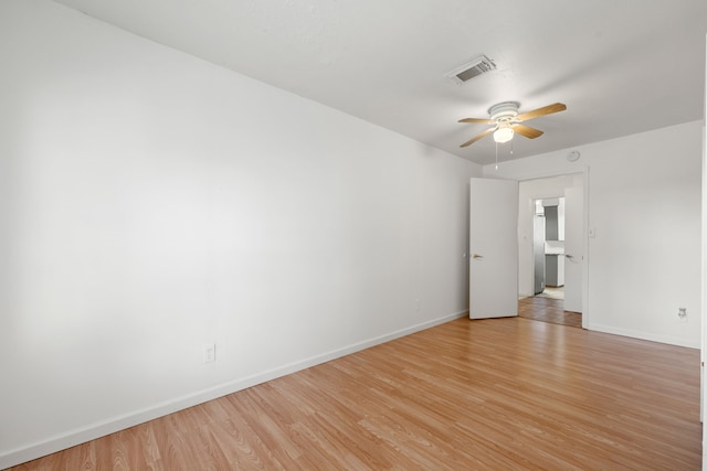 unfurnished room featuring light hardwood / wood-style flooring and ceiling fan