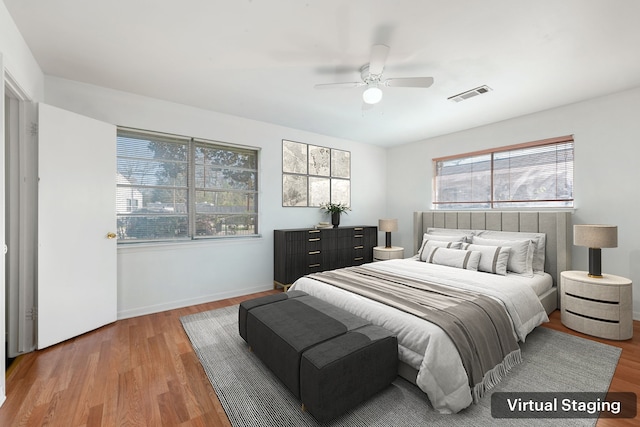 bedroom featuring hardwood / wood-style floors and ceiling fan