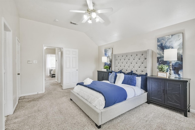 carpeted bedroom with vaulted ceiling and ceiling fan