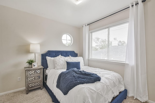 carpeted bedroom with multiple windows