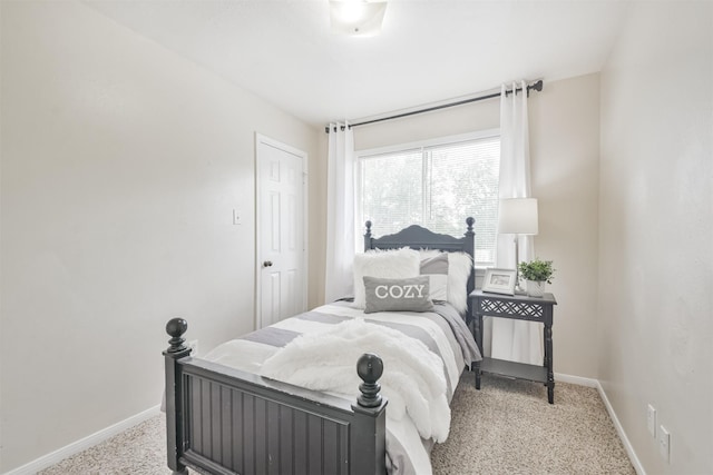 bedroom featuring light carpet