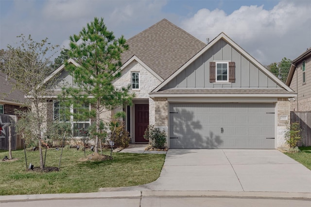 view of front facade featuring a front yard and a garage